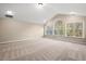 Spacious bedroom with vaulted ceiling and large windows offering serene views of nature at 9 Water Stone Ct, Durham, NC 27705