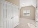 Bright bedroom with a neutral color palette, a vaulted ceiling, and a large closet for ample storage at 9 Water Stone Ct, Durham, NC 27705