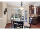 Cozy breakfast nook with views to the deck through the window at 9 Water Stone Ct, Durham, NC 27705