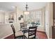 Bright breakfast nook with large windows and hardwood flooring at 9 Water Stone Ct, Durham, NC 27705