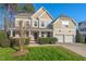 Charming two-story home with a manicured front yard and a two-car garage offers great curb appeal at 9 Water Stone Ct, Durham, NC 27705