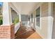 Inviting front porch with classic rocking chairs and wooden floors, perfect for relaxing and enjoying the outdoors at 9 Water Stone Ct, Durham, NC 27705