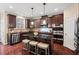 Elegant kitchen with stainless steel appliances, granite counters, and large island at 9 Water Stone Ct, Durham, NC 27705
