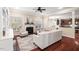 Cozy living room with fireplace, tufted chairs, and a view to the breakfast nook at 9 Water Stone Ct, Durham, NC 27705