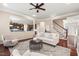 Cozy living room open to kitchen with hardwood floors and soft lighting, creating a welcoming and relaxing atmosphere at 9 Water Stone Ct, Durham, NC 27705