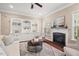 Inviting living room with built-in bookshelves, fireplace, and neutral decor at 9 Water Stone Ct, Durham, NC 27705