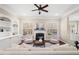 Bright living room with fireplace, built-in bookshelves, and classic design elements at 9 Water Stone Ct, Durham, NC 27705