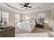 Inviting main bedroom with tray ceiling, neutral tones, and plush carpet for ultimate comfort at 9 Water Stone Ct, Durham, NC 27705