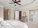 Elegant main bedroom boasts a tray ceiling, plush carpet, and easy access to walk-in closet at 9 Water Stone Ct, Durham, NC 27705