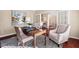 Cozy home office setup with natural light, desk space, and comfortable seating creates a productive and inviting atmosphere at 9 Water Stone Ct, Durham, NC 27705
