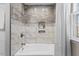 Bathroom shower with tiled walls, bathtub, and modern fixtures at 901 Emory Ln, Raleigh, NC 27609