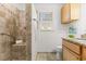 Bathroom showcasing a tiled shower, granite vanity, and stylish fixtures at 901 Emory Ln, Raleigh, NC 27609