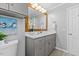 Bathroom with gray cabinets, countertop, and updated fixtures at 901 Emory Ln, Raleigh, NC 27609