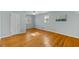 Bright bedroom features hardwood floors, natural light, and neutral paint at 901 Emory Ln, Raleigh, NC 27609