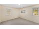 Bedroom featuring light-colored walls, recessed lights, and two windows at 901 Emory Ln, Raleigh, NC 27609