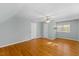 Spacious bedroom with hardwood floors, ceiling fan, and natural light at 901 Emory Ln, Raleigh, NC 27609