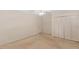 Carpeted bedroom with neutral walls, a ceiling fan, and a closet with bi-fold doors at 901 Emory Ln, Raleigh, NC 27609