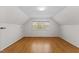 Bright bedroom with hardwood floors and a large window at 901 Emory Ln, Raleigh, NC 27609