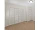 Bedroom with carpeted flooring, double door closet, and recessed lighting at 901 Emory Ln, Raleigh, NC 27609
