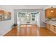 Bright breakfast nook with hardwood floors and lots of natural light from the surrounding windows at 901 Emory Ln, Raleigh, NC 27609