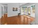 Open breakfast nook with wood flooring and doors to the backyard at 901 Emory Ln, Raleigh, NC 27609