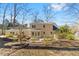 Back exterior view of a well-maintained home with a spacious yard at 901 Emory Ln, Raleigh, NC 27609