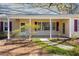 Welcoming front porch with a brick accent wall, perfect for relaxing and enjoying the neighborhood at 901 Emory Ln, Raleigh, NC 27609