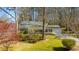 Charming single-story home featuring well-manicured lawn and beautiful landscaping at 901 Emory Ln, Raleigh, NC 27609