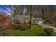 Charming single-story home featuring well-manicured lawn and beautiful landscaping at 901 Emory Ln, Raleigh, NC 27609