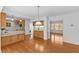 Open concept kitchen with hardwood floors, granite countertops and wooden cabinetry at 901 Emory Ln, Raleigh, NC 27609