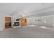 Spacious living room featuring a fireplace, wood cabinetry, and lots of natural light at 901 Emory Ln, Raleigh, NC 27609
