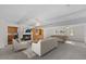 Large living room with a fireplace, built-in cabinets, hardwood floors, a pool table and ample seating at 901 Emory Ln, Raleigh, NC 27609