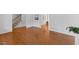 Open living space with hardwood floors, leading to a staircase and other living areas at 901 Emory Ln, Raleigh, NC 27609