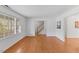Bright living room with hardwood floors, white walls, and an open layout for easy entertaining at 901 Emory Ln, Raleigh, NC 27609