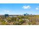 City skyline view with trees and some single Gathering homes below and big bright sky above at 901 Emory Ln, Raleigh, NC 27609