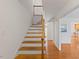 Inviting staircase with wooden steps and white risers leading to the upper level at 901 Emory Ln, Raleigh, NC 27609