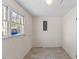 Functional utility room featuring tile floors and a window for natural light at 901 Emory Ln, Raleigh, NC 27609