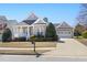 Charming single-story home featuring a well-manicured lawn, covered porch and attached garage at 922 Tupelo Glen Ct, Fuquay Varina, NC 27526