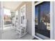 Inviting front porch with rocking chairs, perfect for relaxing and enjoying the outdoors at 922 Tupelo Glen Ct, Fuquay Varina, NC 27526