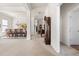 Hallway connecting to dining room with views of the living room and front door at 922 Tupelo Glen Ct, Fuquay Varina, NC 27526