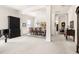 Open-concept living room with piano, dining area, and elegant furnishings, perfect for entertaining at 922 Tupelo Glen Ct, Fuquay Varina, NC 27526