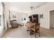 Open living room with fireplace, entertainment center, and adjacent dining area at 922 Tupelo Glen Ct, Fuquay Varina, NC 27526