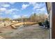 Scenic backyard view overlooking a pond, complemented by a well-maintained lawn and serene landscape at 101 Maroon Ct, Raleigh, NC 27610