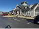Modern clubhouse featuring stone accents, ample parking, and well-maintained landscaping at 101 Maroon Ct, Raleigh, NC 27610