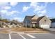 Charming gray home featuring an attached two-car garage and manicured lawn on a tree-lined street at 101 Maroon Ct, Raleigh, NC 27610