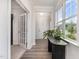 Bright foyer with natural light, hardwood floors, and views to front door and other rooms at 101 Maroon Ct, Raleigh, NC 27610
