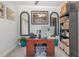 Inviting home office featuring a wooden desk, decorative mirrors, and a stylish storage unit at 101 Maroon Ct, Raleigh, NC 27610
