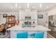 Bright kitchen with a central island, white cabinets, and stainless steel appliances at 101 Maroon Ct, Raleigh, NC 27610
