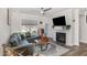 Cozy living room featuring a fireplace, a leather sofa, and a modern coffee table at 101 Maroon Ct, Raleigh, NC 27610