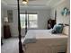 Comfortable main bedroom featuring a four-poster bed, soft bedding, and serene decor at 101 Maroon Ct, Raleigh, NC 27610